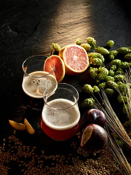 Photo of Two types of beer in a tasting glass with fruity flavors