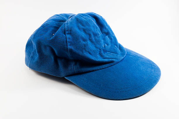 Crumpled blue cap isolated on white background closeup