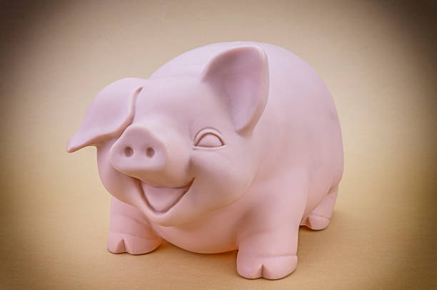 istock Kids Pink Piggy Bank Looking Forward 520971788