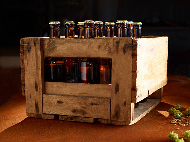 istock A wooden box with beer bottles and fresh hops on a rusty plate 520973546