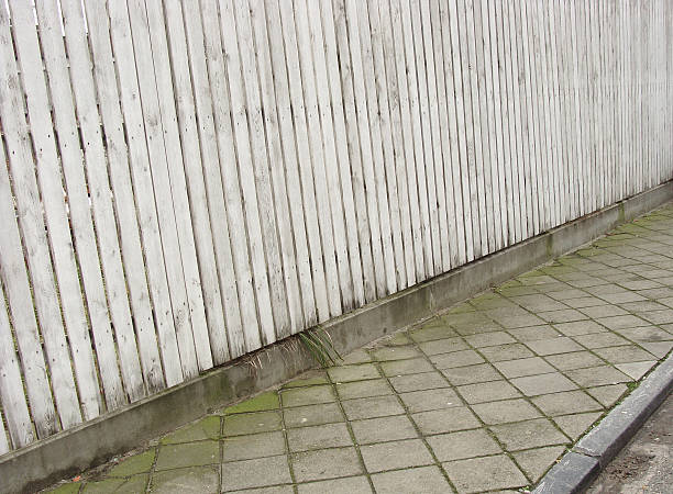 istock side-walk pavement and white wooden fence 520974077