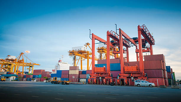 istock Container ship in the harbor in Asia , 520975847