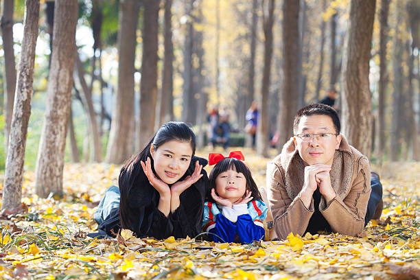 istock happy family togetherness portrait in forest 520976169