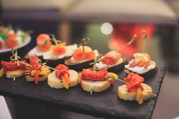 istock Beautifully decorated catering banquet table with different food snacks appetizers 520976224