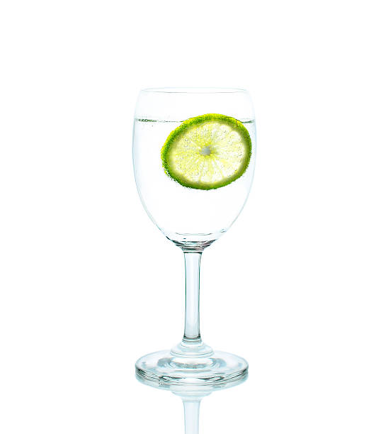 istock glass of cocktail with lime and mint isolated on white 520976851