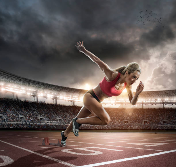 istock Professional Female Athlete Sprinting Off Blocks 520977147