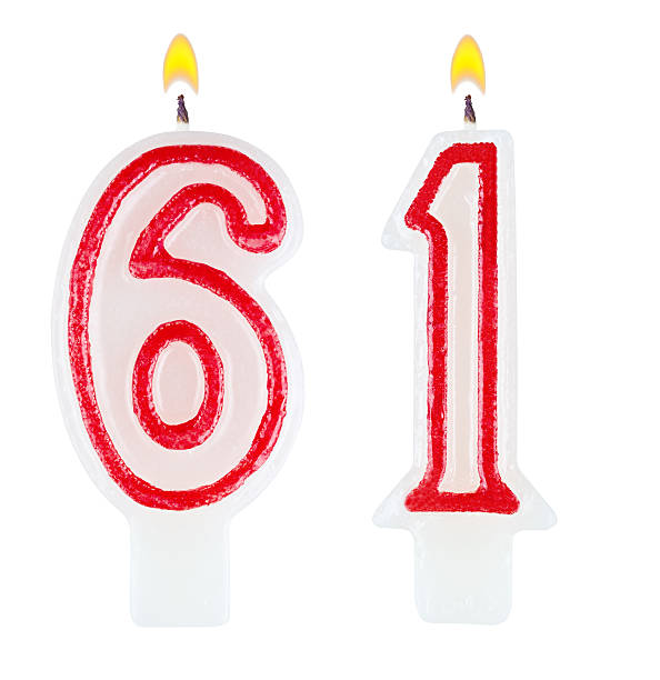 istock Birthday candles number sixty one isolated on white background 520977963