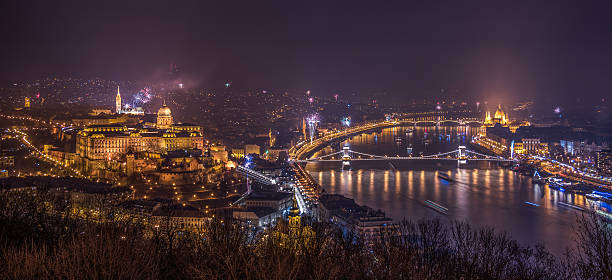 Fireworks over Budapest, Hungary New Year Celebration. Fireworks over Budapest, Hungary. Illuminated Royal Palace by Danube River. gellert stock pictures, royalty-free photos & images
