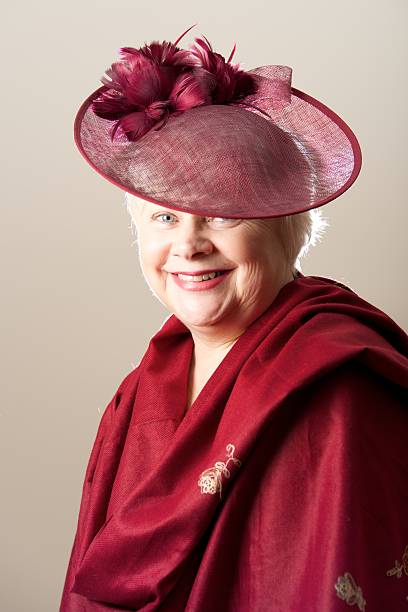 istock Smiling white-haired woman in hat and shawl 520978181