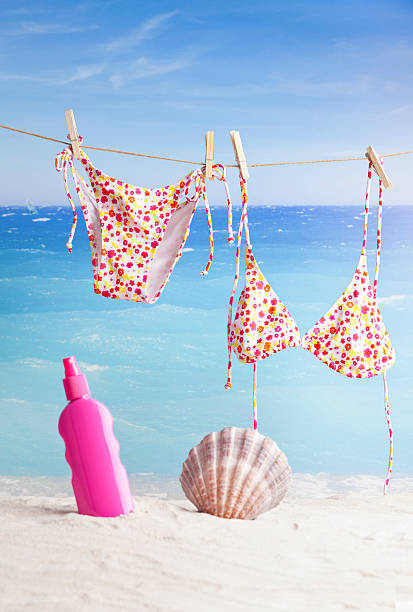 istock bikini hanging on tropical beach, summer concept 520978313