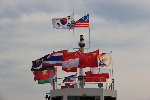 Flags of many countries on a ship to Namiseom or Namisum or Nami Island, a famous tourist attraction in South Korea