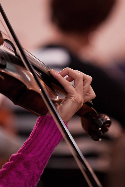 istock Hands girl playing the violin 520979707