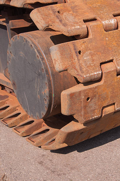 istock Closeup of rusty caterpillar tracks 520979991