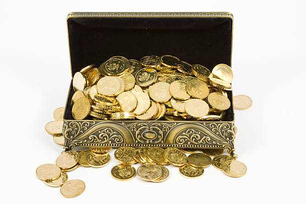 istock gold casket and gold coins on a white background 520980939