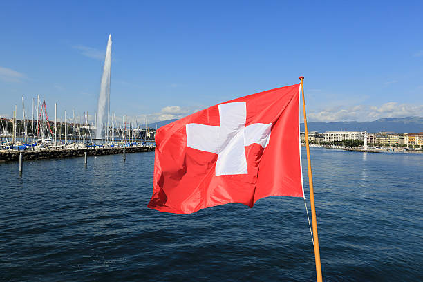 istock Swiss flag over lake Geneva 520981209