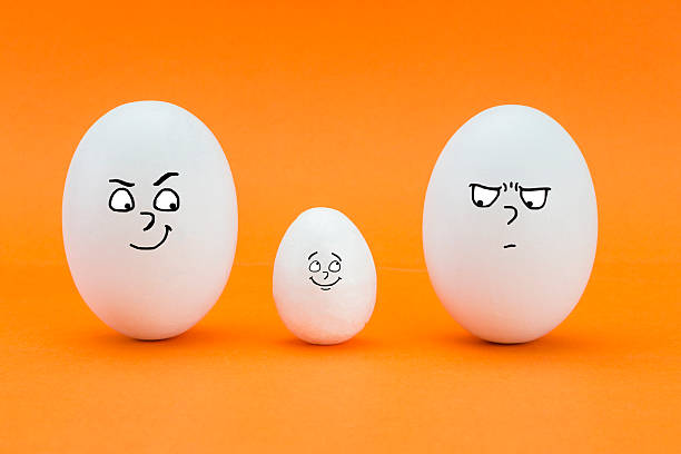 istock two big eggs look with face of few friends 520981820
