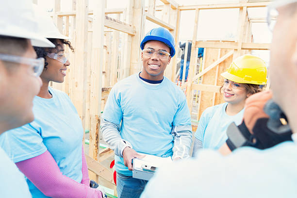 istock Attentive volunteers listen to construction manager 520982940