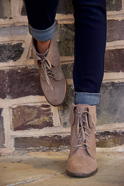 istock Women's shoes against brick wall 520982948