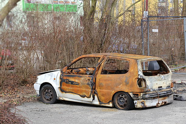 istock Car wreck with flat tires standing on parking place 520983138
