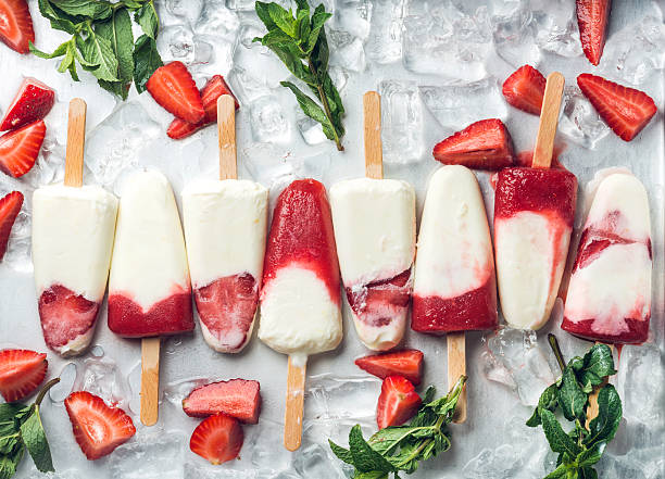 Strawberry yogurt ice cream popsicles with mint