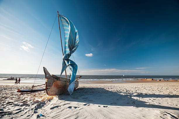 Malagasy boat Traditional Malagasy sail boat on the sea coast. Town of Morondava, Madagascar mozambique channel stock pictures, royalty-free photos & images