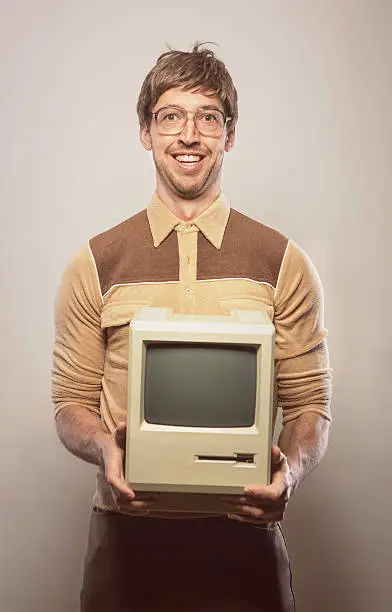 Photo of Goofy glasses wearing nerdy IT Computer guy