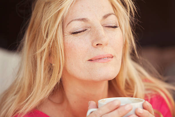 istock Happy woman drinking coffee 520984898