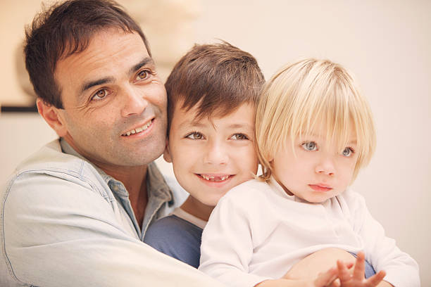 istock Happy dad and kids portrait 520985186