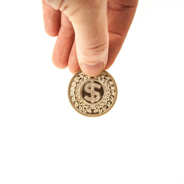istock Dropping Gold Dollar Sign Coin 520985234