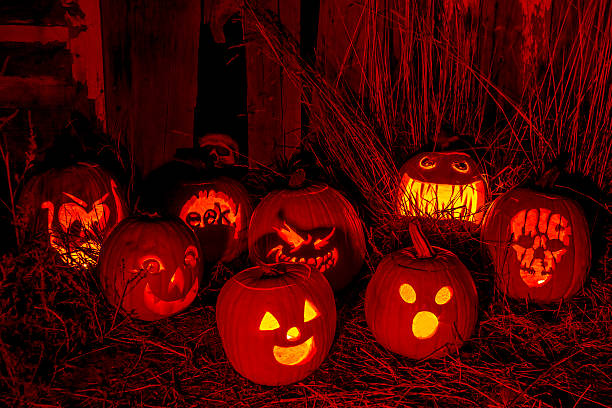 istock Lighted Halloween Pumpkins with Candles 520998817