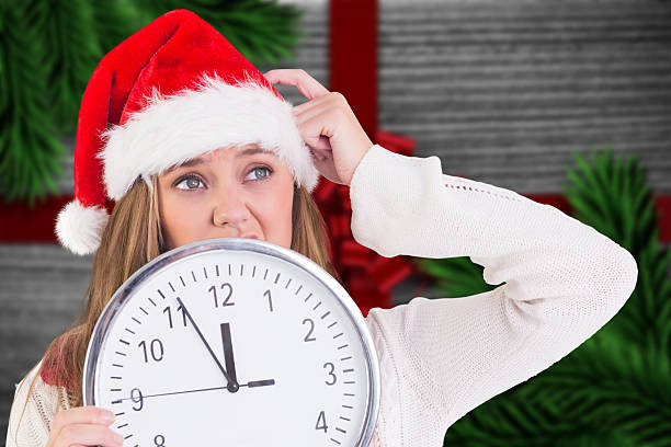 istock Composite image of festive blonde showing a clock 520999203