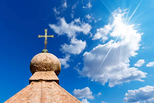 Photo of Bronze Cross on Blue Sky