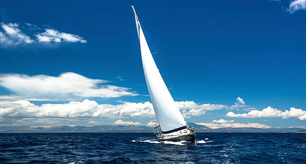 istock Lonely sailboat at sea. Romantic trip luxury yacht. 521000033
