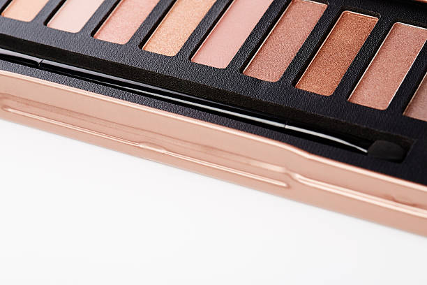 istock Close up on eye shadow palette against white background 521000209
