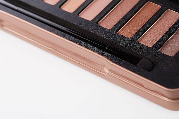 istock Close up on eye shadow palette against white background 521000755