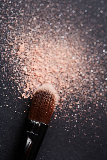 istock Powder scattered on black background from make up brush 521000919