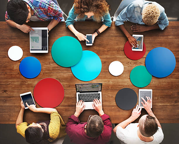 istock Diverse People Hands Team Busy Devices Concept 521001104