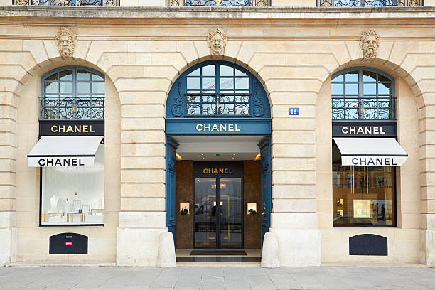 Chanel shop in place Vendome in Paris Paris, France - July 8, 2014: Chanel shop in place Vendome in Paris. Chanel is a fashion house founded in 1909 specialized in haute couture and luxury goods. paris fashion stock pictures, royalty-free photos & images