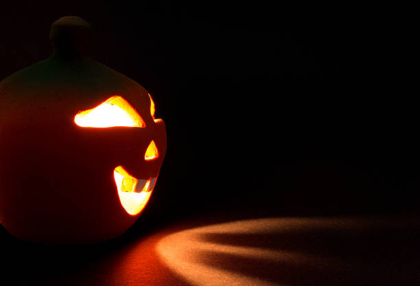 istock Halloween pumpkin on black background 521002119