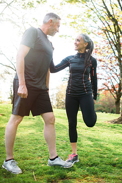 istock Mature Couple Stretching After Run 521002216
