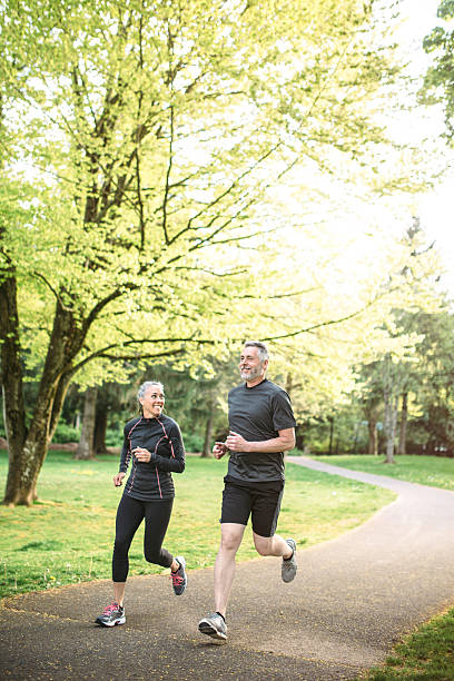 istock Mature Couple Jogging Outdoors 521002450