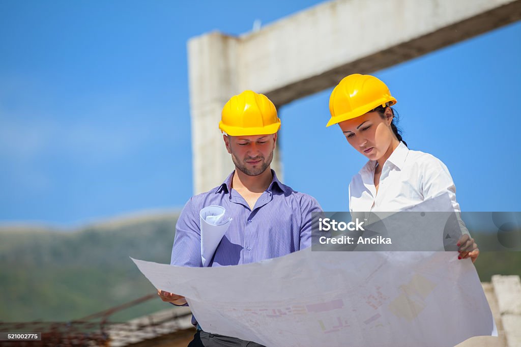 Construction manager  architect Construction manager and engineer woman working on building site Adult Stock Photo