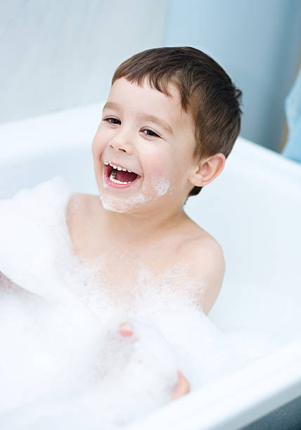 istock Child bathes in a bathroom 521002931