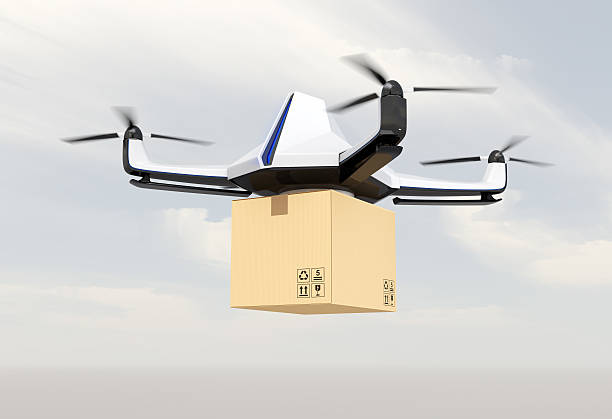 istock Autonomous unmanned drone delivering cardboard box in the sky 521004838