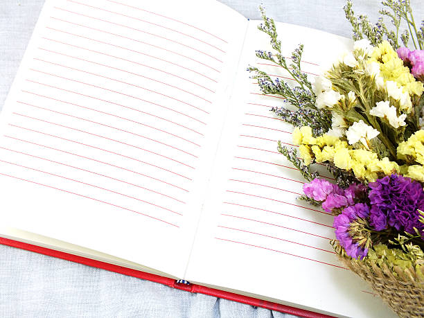 istock open notebook and beautiful statice flowers bouquet 521004988