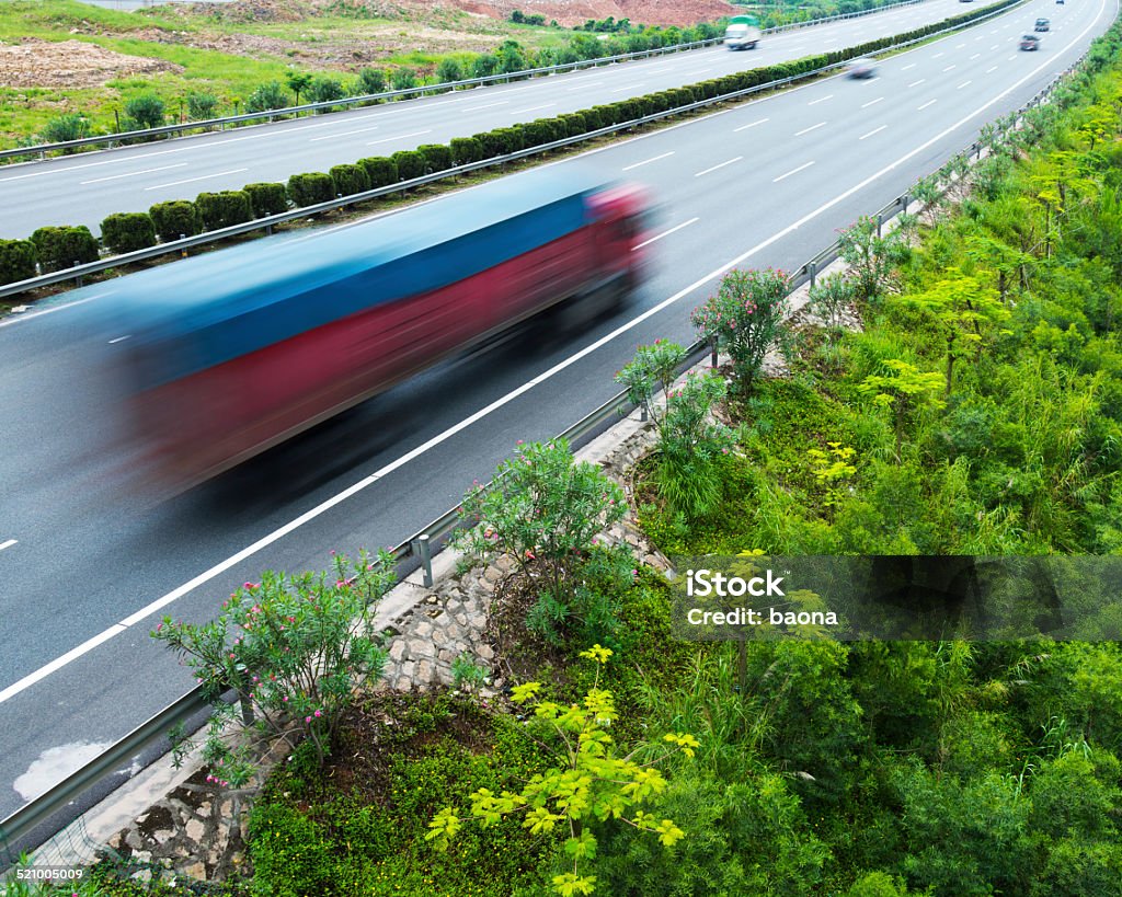 highway highway with speeding trucks and cars. Activity Stock Photo