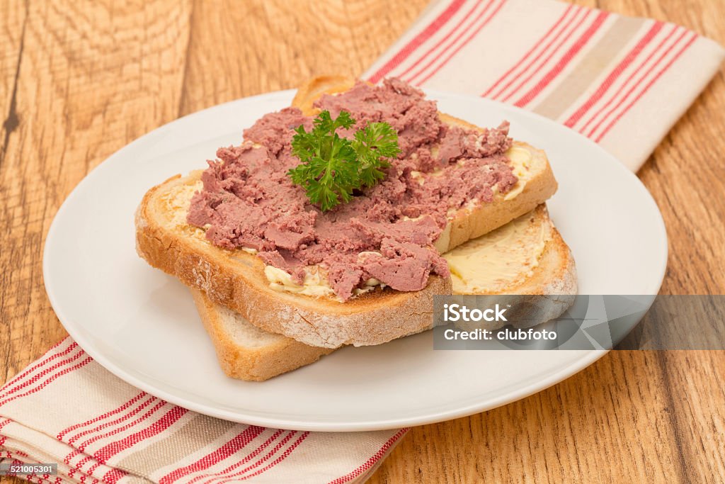 Pate on toast Farmhouse pate on buttered bread toast - studio shot Appetizer Stock Photo