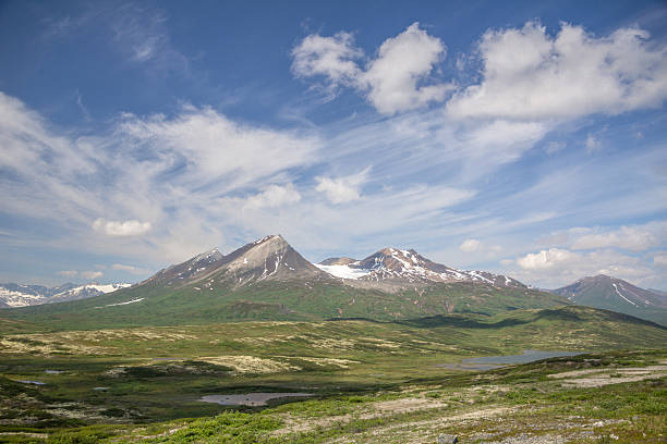 Mountains and glaciers of Tatshenshini-Alsek Provincial Park, Northern British Columbia taken from the Haines Road between the BC-Yukon border and the BC-Alaska border on a partly cloudy day in spring 2015