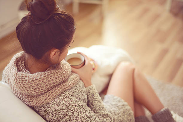 istock young brunette woman in home interior. 521005553