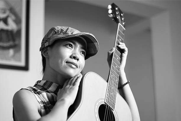 istock girl with the guitar 521006408